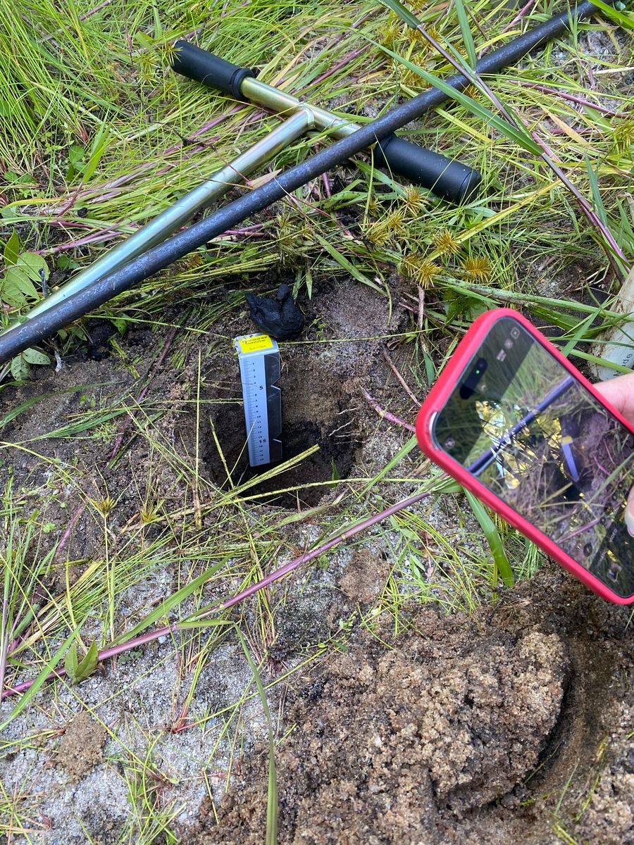 Christine photographs probe hole